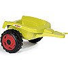Claas dzeltenais kalnrūpniecības traktors ar piekabi